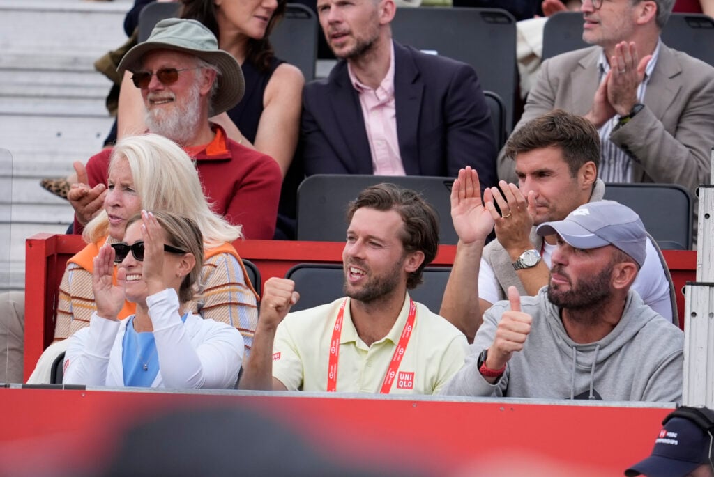 Emma Raducanu's team watch her play at Queen's in 2026.