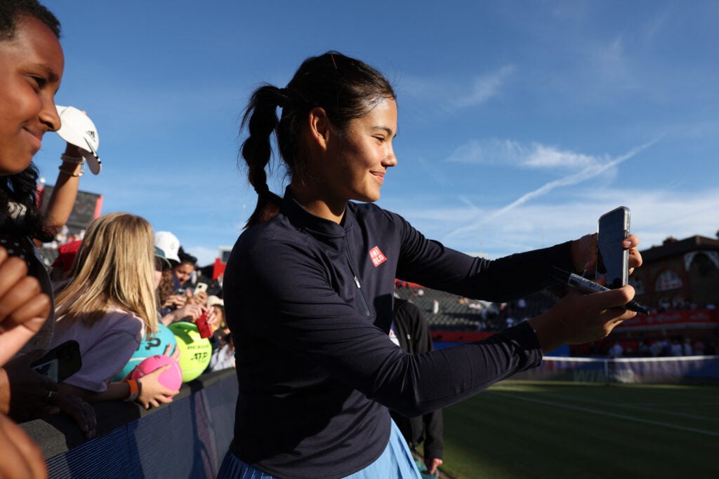 Emma Raducanu takes a selfie with a fan after reaching the Queen's final.