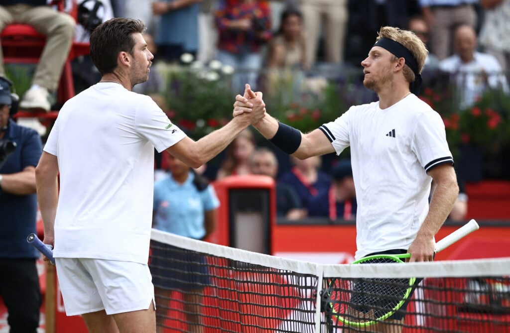 Spain's Alejandro Davidovich Fokina shakes hands with Britain's Cameron Norrie after winning their men's singles round of 32 tennis match on day two of the ATP HSBC Championships at Queen's Club in west London on June 16, 2026.