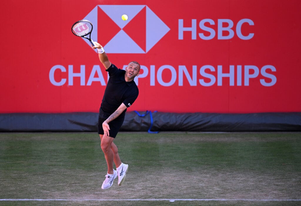 Daniel Evans of Great Britain serves against Marcos Giron of the United States during the Men's Singles qualifier match on Day Six of the HSBC Championships at The Queen's Club on June 13, 2026 in London, England.