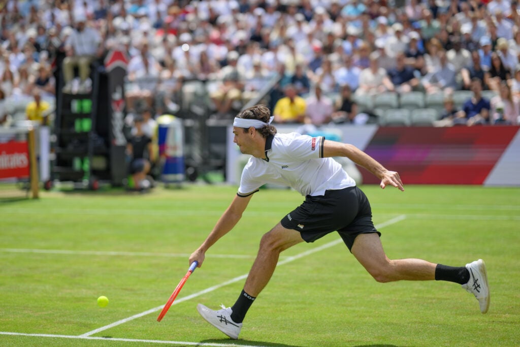 Taylor Fritz returns a drop shot against Ben Shelton in Stuttgart.