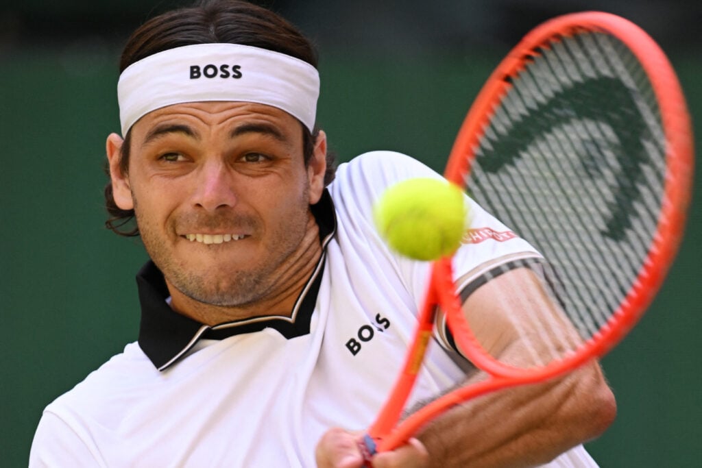Taylor Fritz hits a return during the Halle Open quarter-finals.