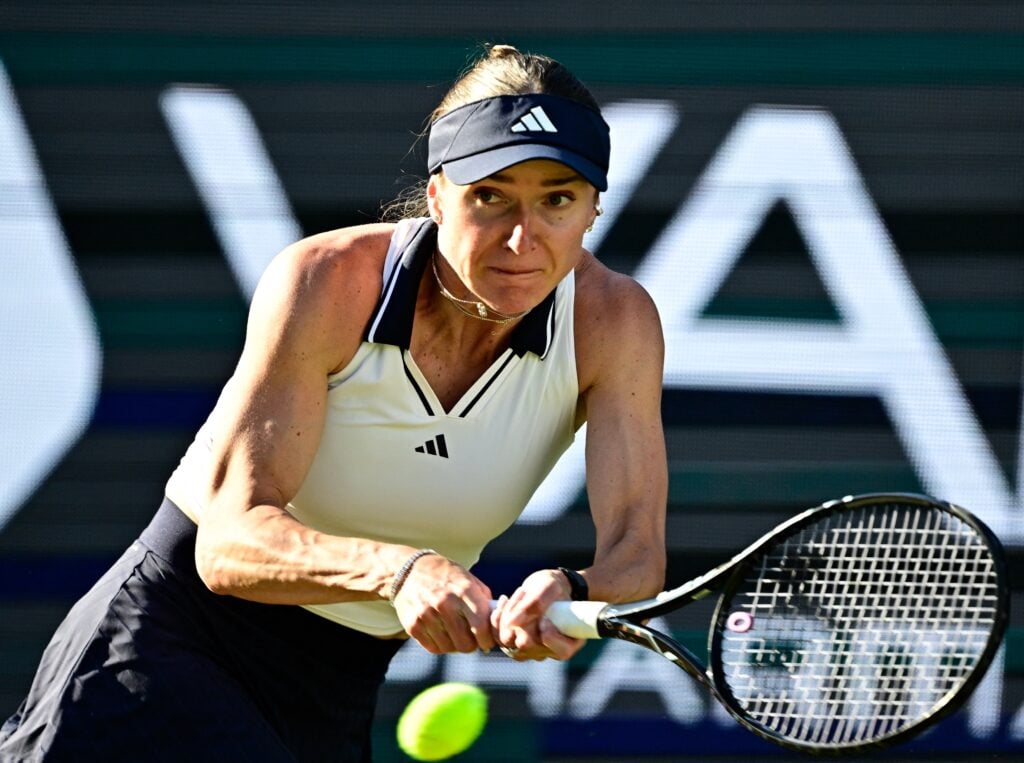 Elina Svitolina hits a backhand against Alex Eala at the 2026 Berlin Open.