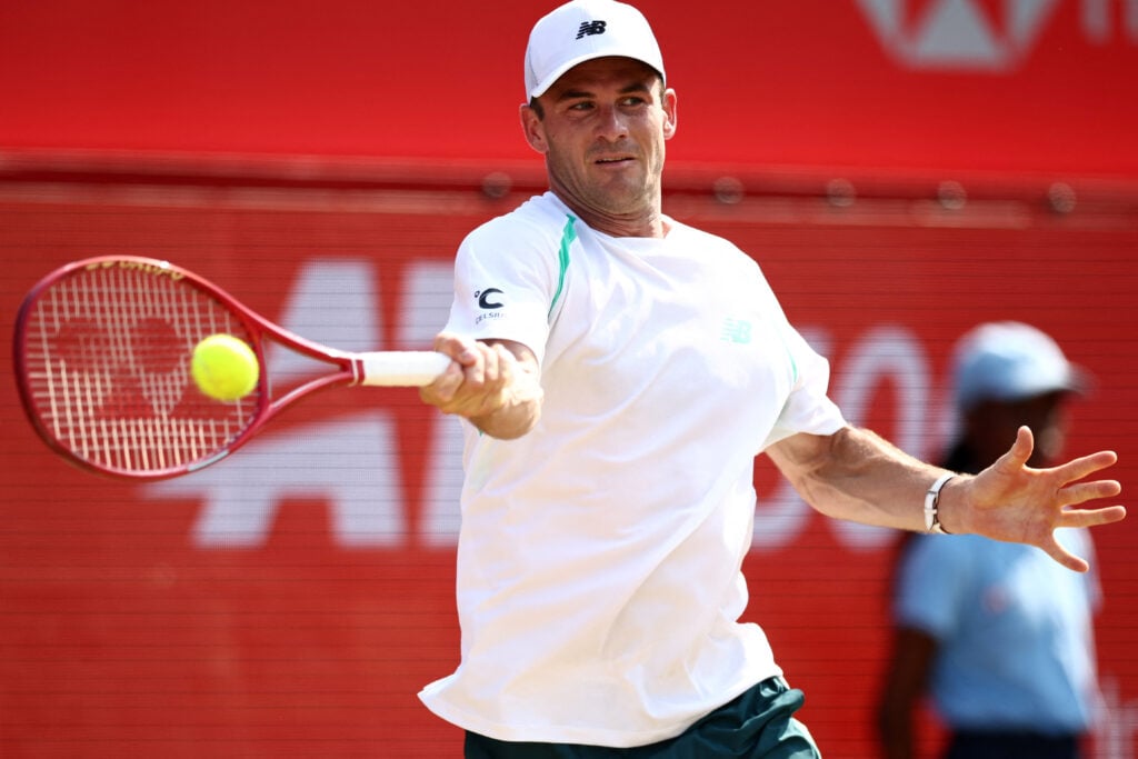US player Tommy Paul returns to Argentina's Francisco Cerundolo during the men's singles final tennis match on day six of the ATP HSBC Championships at Queen's Club in west London on June 21, 2026.
