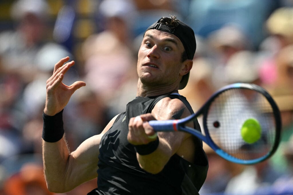 Jack Draper hits a forehand at Eastbourne in 2026.