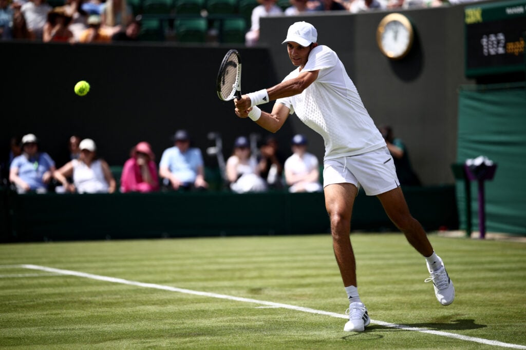 Spain's Rafael Jodar returns to Britain's Felix Gill during their men's singles first round tennis match on the first day of the 2026 Wimbledon Championships at The All England Lawn Tennis and Croquet Club in Wimbledon, southwest London, on June 29, 2026.