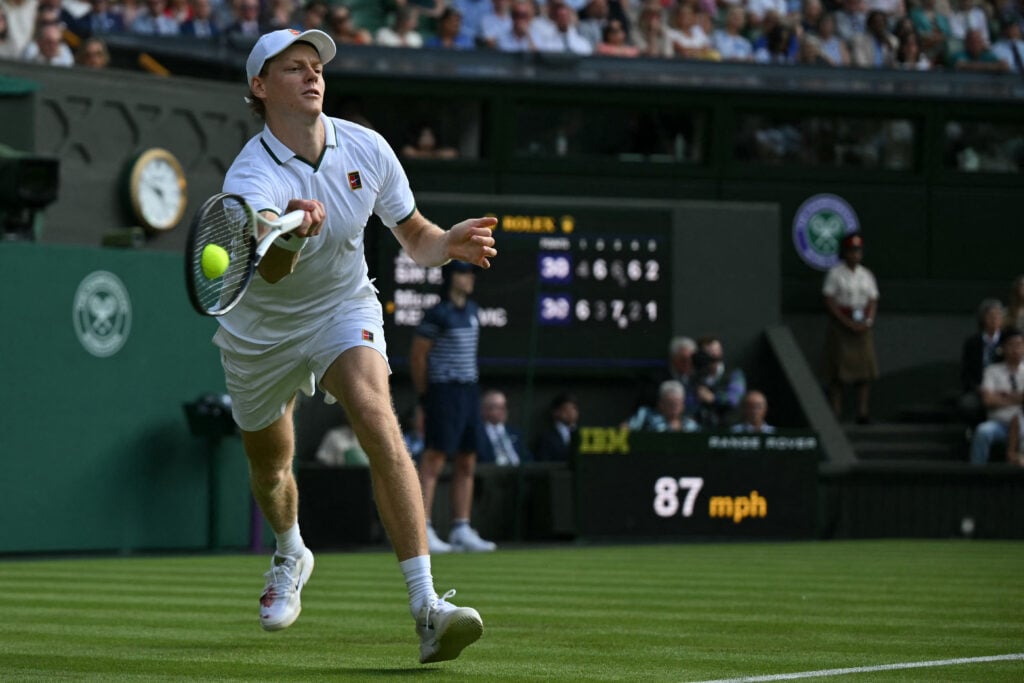 Italy's Jannik Sinner returns the ball to Serbia's Miomir Kecmanovic during their men's singles first round tennis match on the first day of the 2026 Wimbledon Championships at The All England Lawn Tennis and Croquet Club in Wimbledon, southwest London, on June 29, 2026.