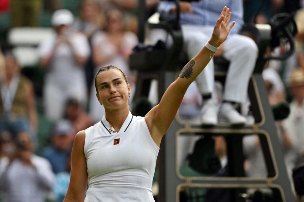 Aryna Sabalenka celebrates after beating Teodora Kostovic at Wimbledon in 2026.