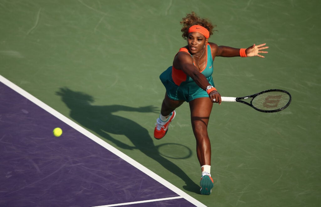 Serena Williams of the United States stretches for a backhand against Yaroslava Shvedova of Kazakhstan during their second round match during day 4 at the Sony Open at Crandon Park Tennis Center on March 20, 2014 in Key Biscayne, Florida.