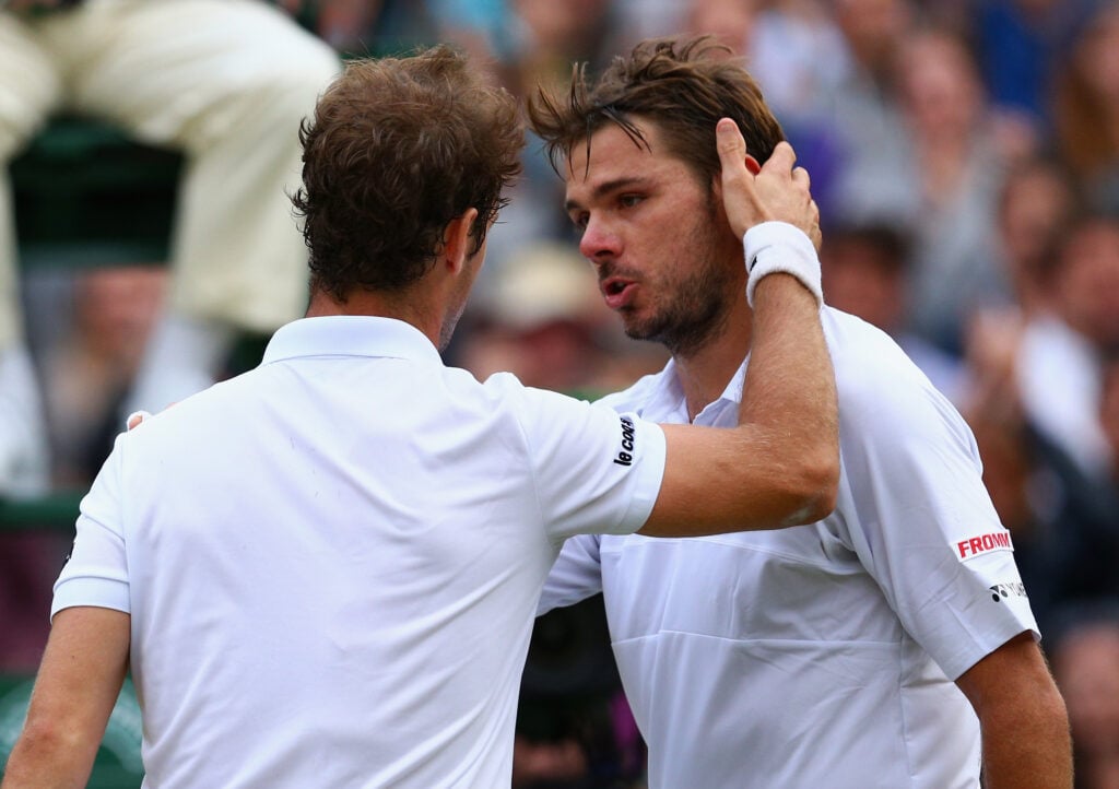 Richard Gasquet and Stan Wawrinka embrace after their Wimbledon quarter-final in 2015.