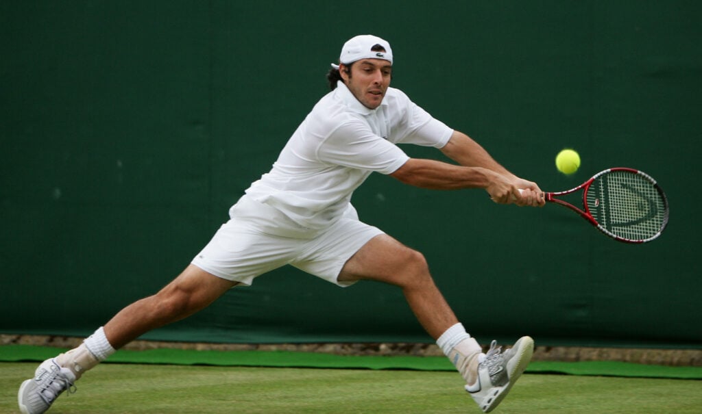 Sebastien Grosjean of France in action against Novak Djokovic of Serbia & Montenegro during the sixth day of the Wimbledon Lawn Tennis Championship on June 25, 2005 at the All England Lawn Tennis and Croquet Club in London.