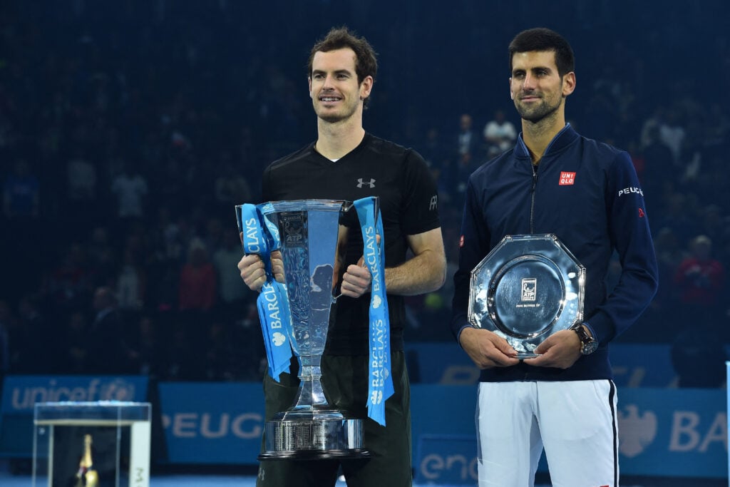 Andy Murray and Novak Djokovic pose with trophies after the 2016 ATP Finals final in London.