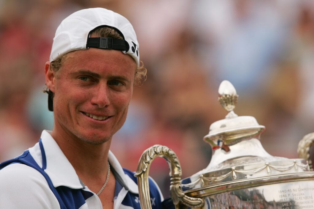 Lleyton Hewitt of Australia holds the trophy after defeating James Blake of the United States during the Singles Final on Day 7 of the Stella Artois Championships at Queen's Club on June 18, 2006 in London, England.
