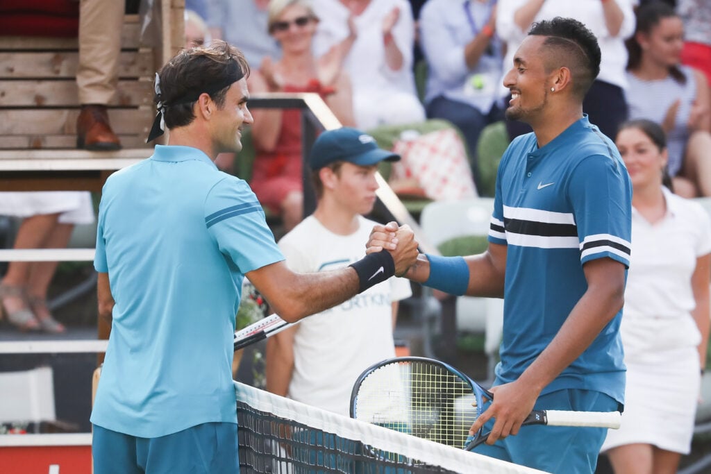 Roger Federer of Switzerland shakes hand with Nick Kyrgios of Australia and returning to the top position in the ATP global ranking during day 6 of the Mercedes Cup at Tennisclub Weissenhof on June 16, 2018 in Stuttgart, Germany.