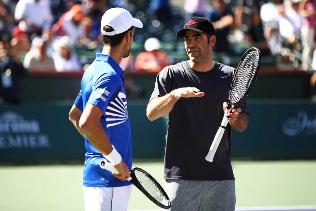 Novak Djokovic and Pete Sampras during an exhibition doubles match at Indian Wells in 2019.