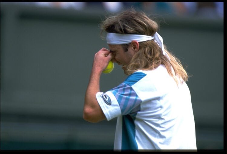 JUN 1987:  ANDRE AGASSI OF THE UNITED STATES SHOWS HIS DESPAIR DURING HIS FIRST ROUND MATCH AT THE 1987 WIMBLEDON TENNIS CHAMPIONSHIPS. AGASSI LOST...