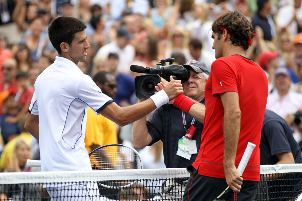 Roger Federer (R) of Switzerland congratulates Novak Djokovic of Serbia after Djokovic won their match during Day Thirteen of the 2011 US Open at the USTA Billie Jean King National Tennis Center on September 10, 2011 in the Flushing neighborhood of the Queens borough of New York City.