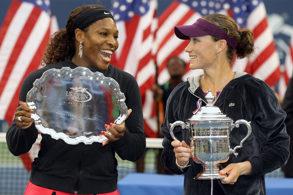 Samantha Stosur of Australia (R) celebrates with the championship trophy alongside Serena Williams of the United States (L) who poses with the second place trophy after their Women's Singles Final match on Day Fourteen of the 2011 US Open at the USTA Billie Jean King National Tennis Center on September 11, 2011 in the Flushing neighborhood of the Queens borough of New York City.