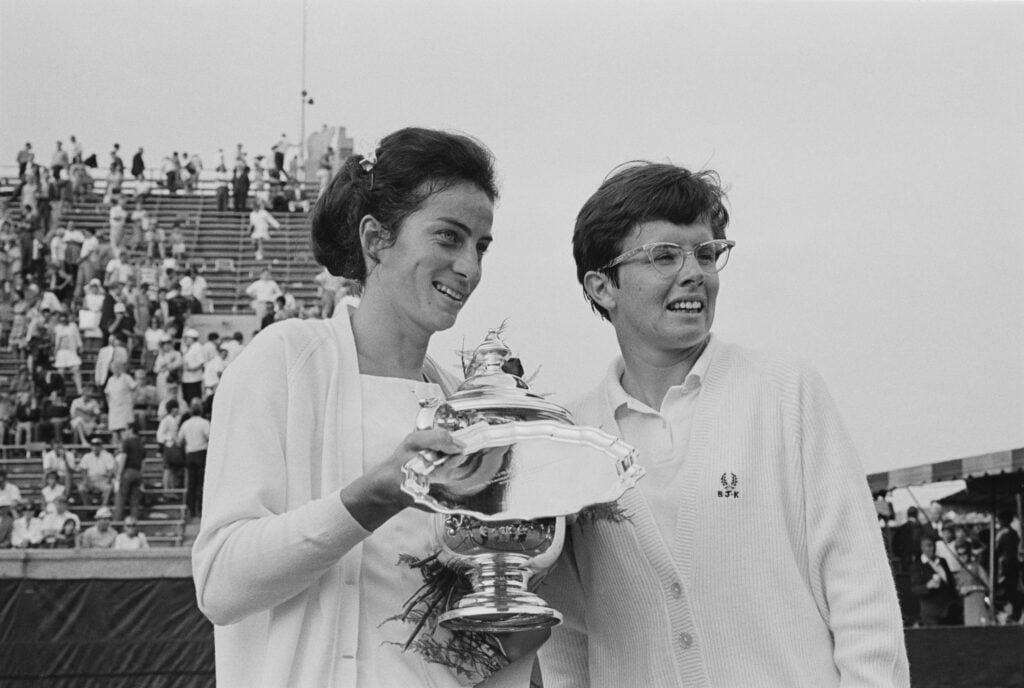 British tennis player Virginia Wade, holding the trophy, alongside American tennis player Billie Jean King, during the presentation ceremony following the Women's Singles Final of the 1968 US Open, held at West Side Tennis Club in the Forest Hills neighbourhood of the Queens borough of New York City, New York, 8th September 1968. Virginia Wade won the match 6–4, 6–2.