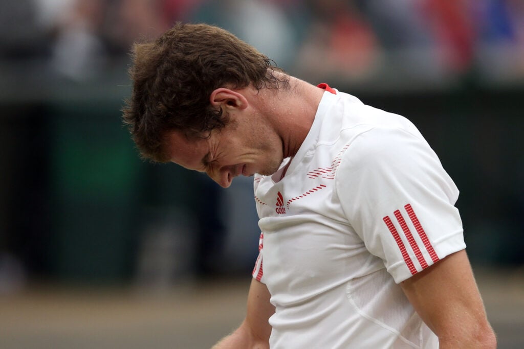 Andy Murray of Great Britain reacts during his Gentlemen's Singles final match against Roger Federer of Switzerland on day thirteen of the Wimbledon Lawn Tennis Championships at the All England Lawn Tennis and Croquet Club on July 8, 2012 in London, England.