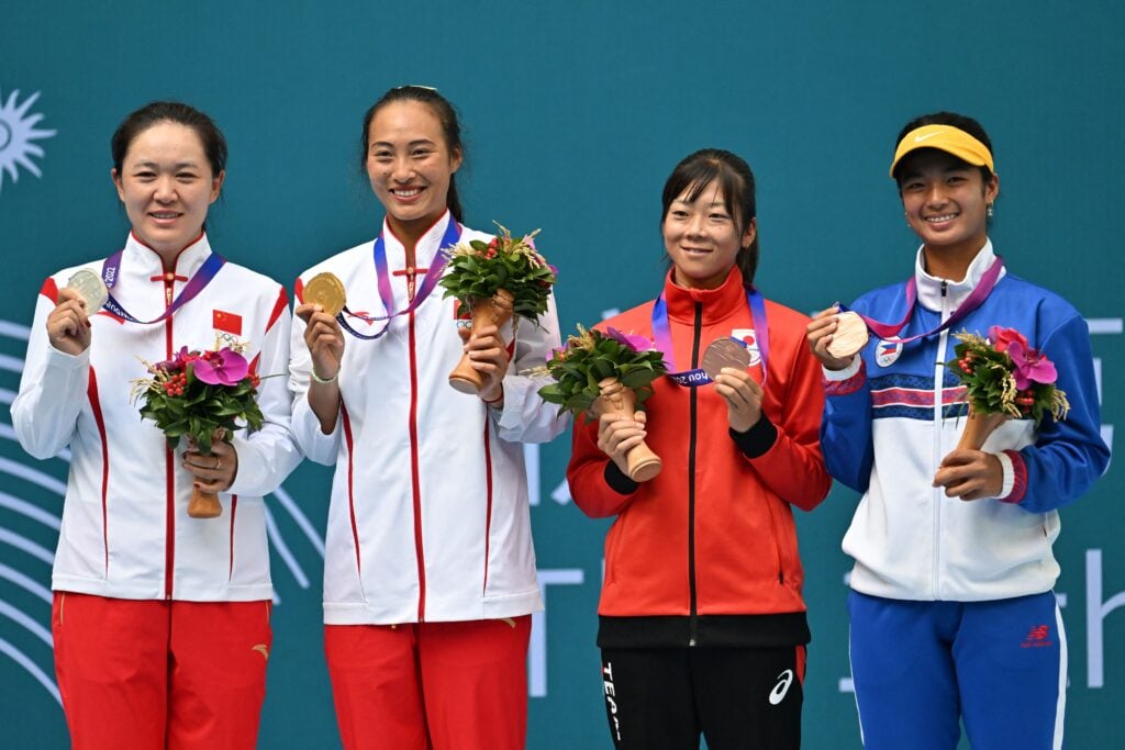 China's gold medallist Zheng Qinwen (2nd L), silver medallist compatriot Zhu Lin (L), bronze medallists Japan's Haruka Kaji (2nd R) and Philippine's Alexandra Eala (R) pose during the awards ceremony following the women's singles final tennis match at the 2022 Hangzhou Asian Games in Hangzhou, in China's eastern Zhejiang province on September 29, 2023.