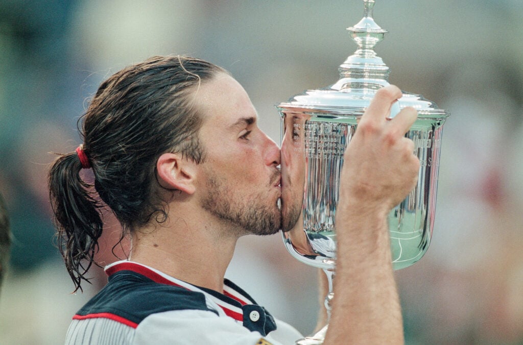 Patrick Rafter of Australia kiss the trophy after defeating Mark Philippoussis of Australia in the Men's Singles Final at United States Open in Flushing, New York on September 13th, 1998 in New York, United States of America.