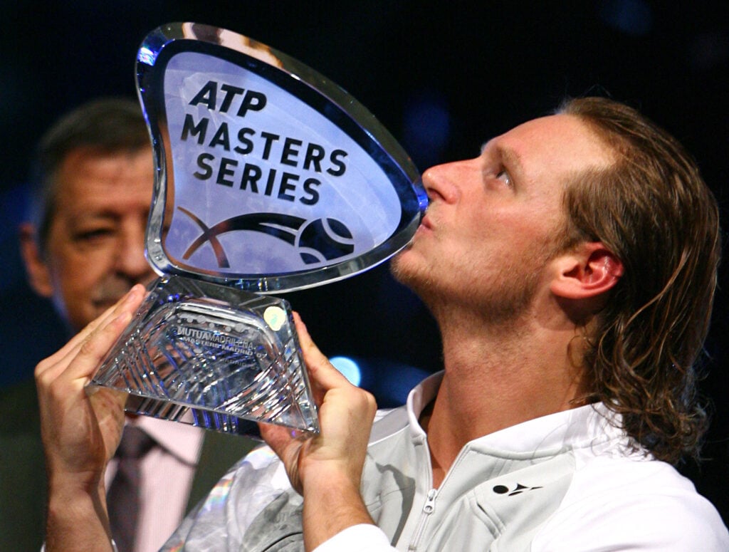 Argentina's David Nalbandian kisses the trophy after beating Swiss Roger Federer in the final of the ATP Tennis Masters in Madrid, 21 October 2007. Nalbandian won 1-6, 6-3, 6-3.