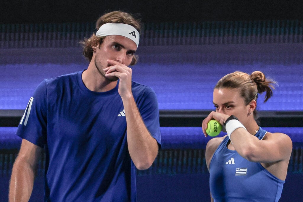 Greece's Maria Sakkari (R) and Stefanos Tsitsipas discuss tactics during their doubles match against Spain's Yvonne Cavalle-Reimers and Sergio Martos Gornes at the United Cup tennis tournament in Perth on December 28, 2024.