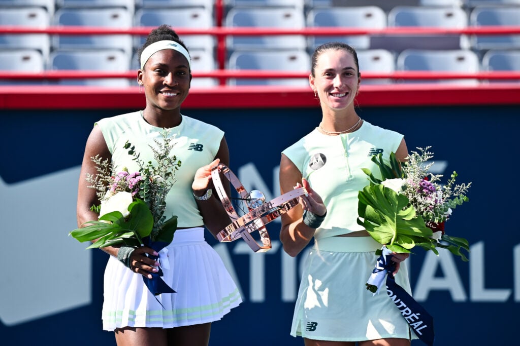 Coco Gauff and McCartney Kessler pose with the trophy after winning the 2026 Canadian Open doubles title.