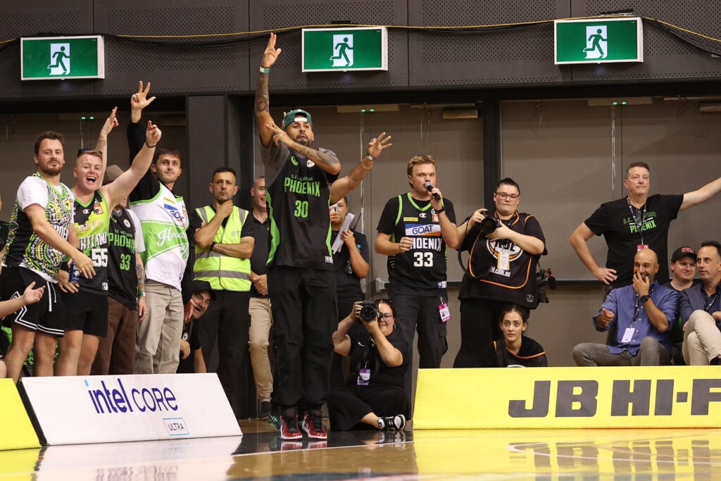 Nick Kyrgios watches an NBL match in 2026.