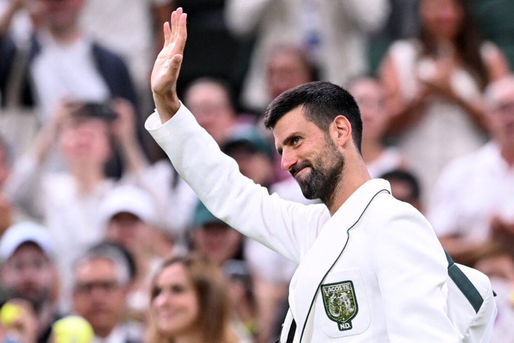 Serbia's Novak Djokovic waves as he leaves the court after winning Greece's Stefanos Tsitsipas during their men's singles second round tennis match on the third day of the 2026 Wimbledon Championships at The All England Lawn Tennis and Croquet Club in Wimbledon, southwest London, on July 1, 2026.