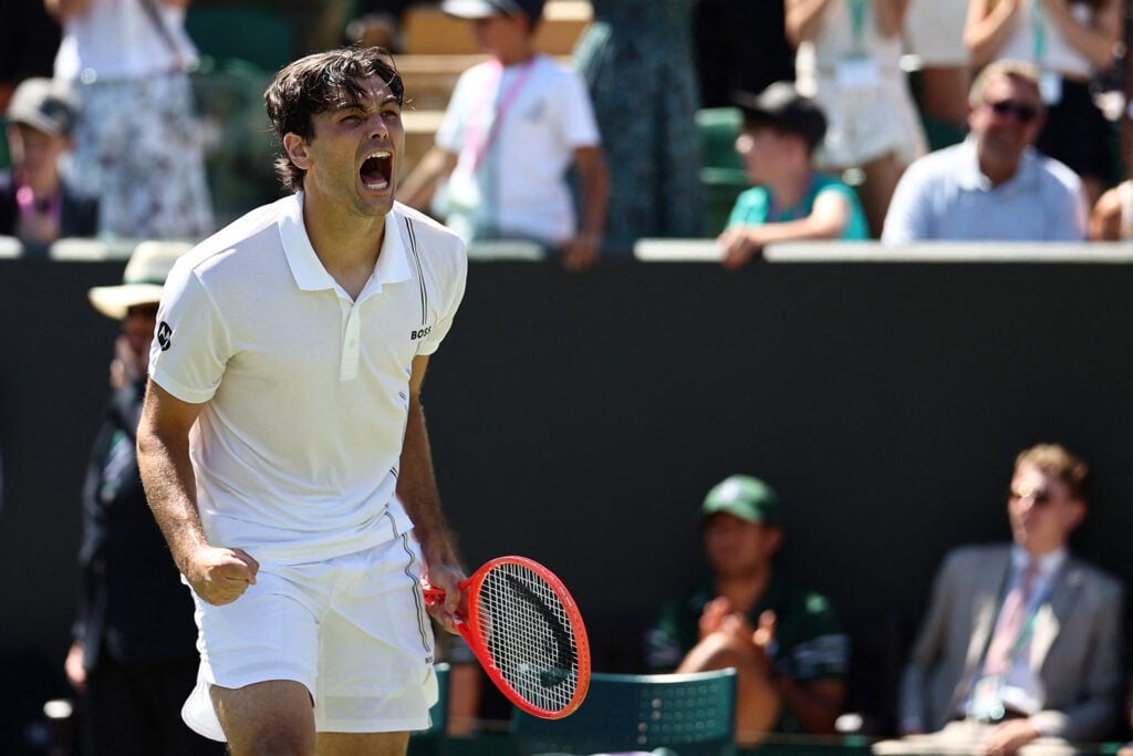 Taylor Fritz celebrates winning his second-round match at Wimbledon in 2026.