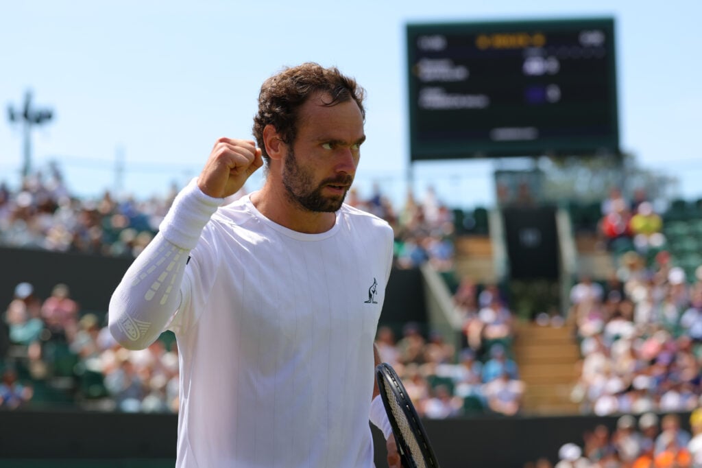 Roman Safiullin celebrates against Joao Fonseca at Wimbledon in 2026.