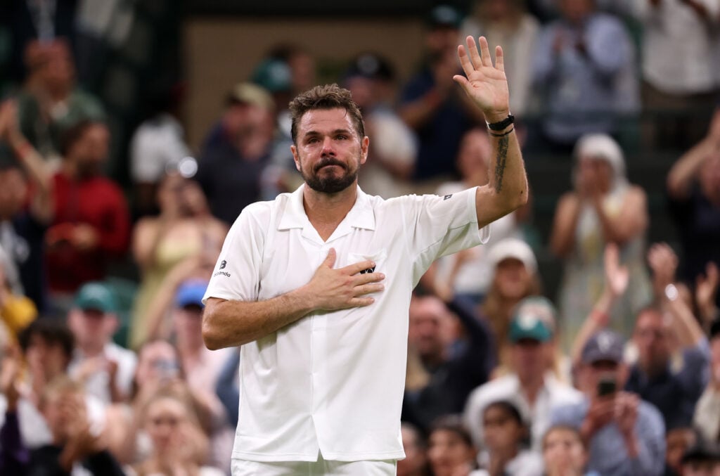 Stan Wawrinka waves to the Wimbledon crowd