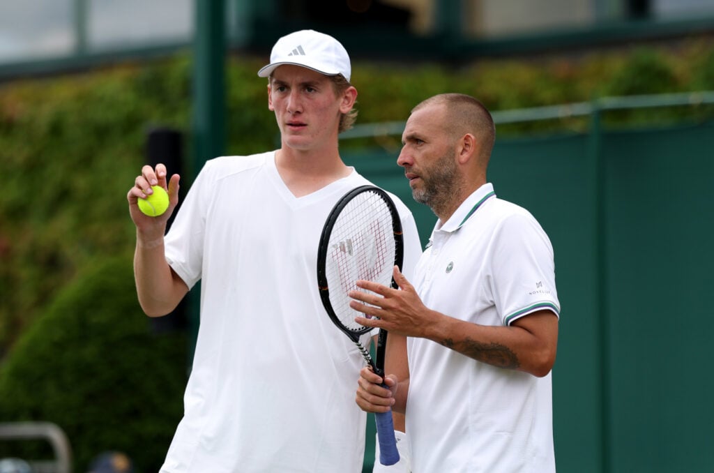 Henry Searle of Great Britain and Daniel Evans of Great Britain talk against Hugo Nys of Monaco and Edouard Roger-Vasselin of France during their Gentlemen's Doubles first round match on day three of The Championships Wimbledon 2026 at All England Lawn Tennis and Croquet Club on July 01, 2026 in London, England.