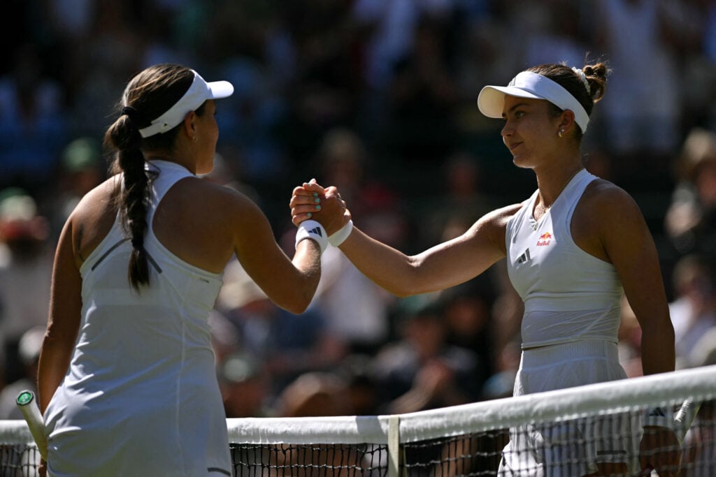 Jessica Pegula shakes Iva Jovic's hand after beating her at Wimbledon in 2026.