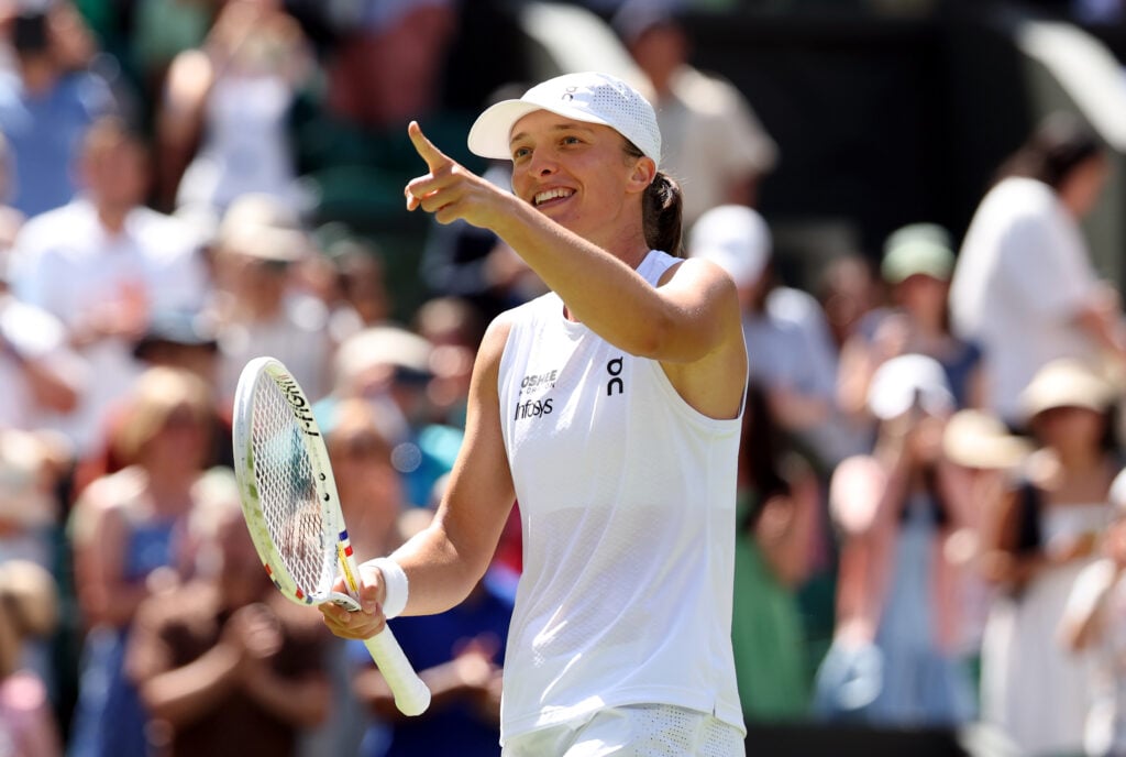 Iga Swiatek celebrates after winning her second-round match at Wimbledon.