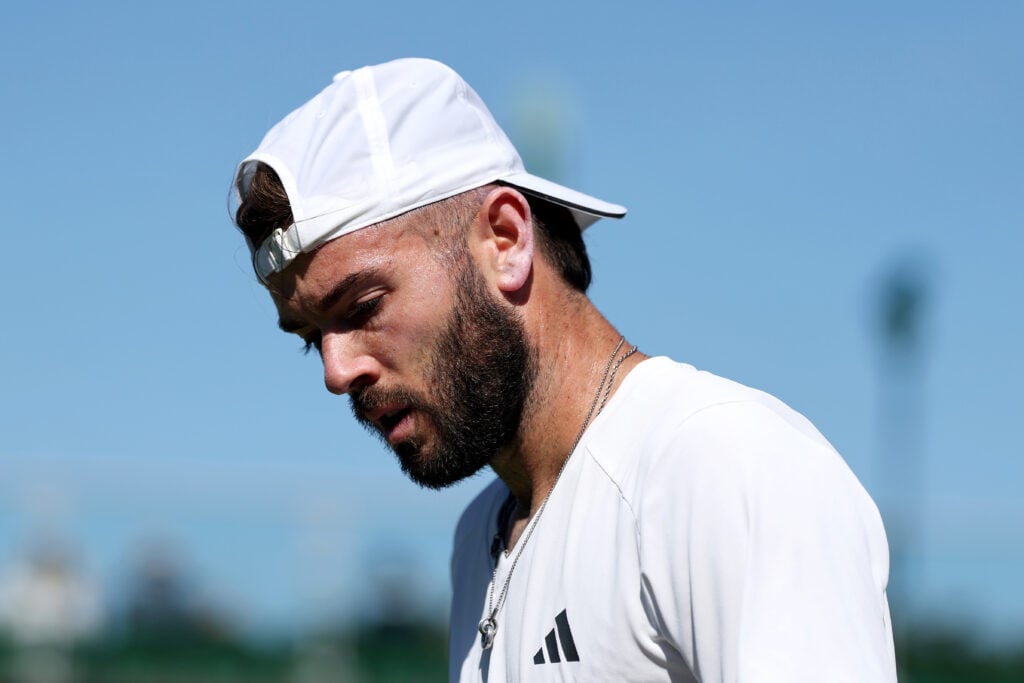 Jacob Fearnley of Great Britain looks on against Jaume Munar of Spain during their Gentlemen's Singles second round match on day four of The Championships Wimbledon 2026 at All England Lawn Tennis and Croquet Club on July 02, 2026 in London, England.