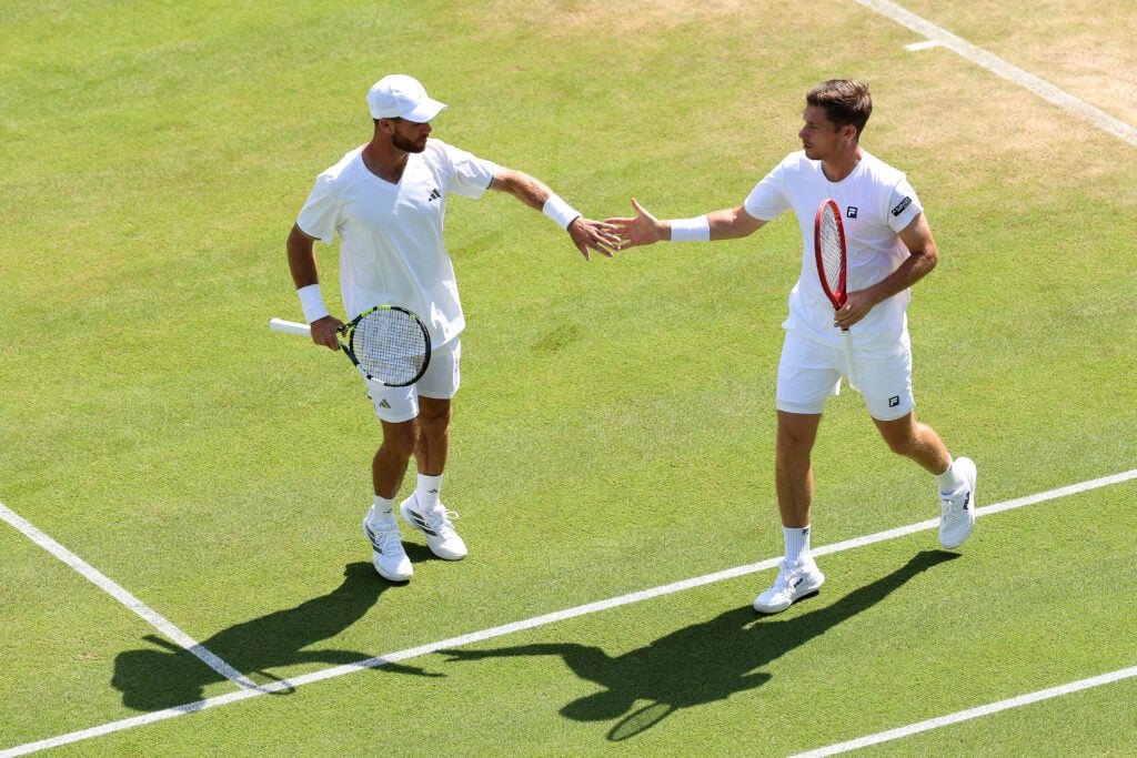 Christian Harrison of United States and Neal Skupski of Great Britain interact against Jakub Paul of Switzerland and Ryan Seggerman of United States during their Gentlemen's Doubles second round match on day five of The Championships Wimbledon 2026 at All England Lawn Tennis and Croquet Club on July 03, 2026 in London, England.