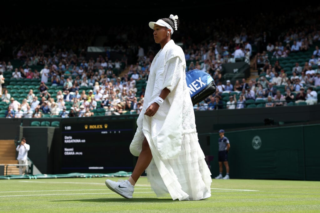 Naomi Osaka of Japan walks onto court wearing her pre match outfit before her Ladies' Singles third round match against Daria Kasatkina of Australia on day five of The Championships Wimbledon 2026 at All England Lawn Tennis and Croquet Club on July 03, 2026 in London, England.