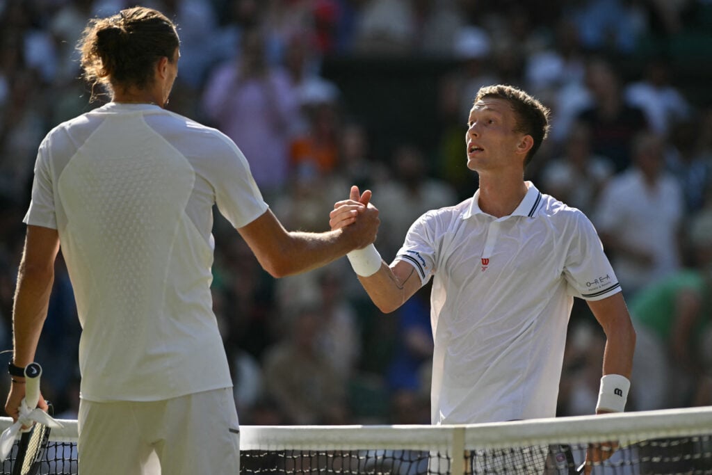 Alexander Zverev and Jiri Lehecka shake hands after their fourth-round match at Wimbledon.