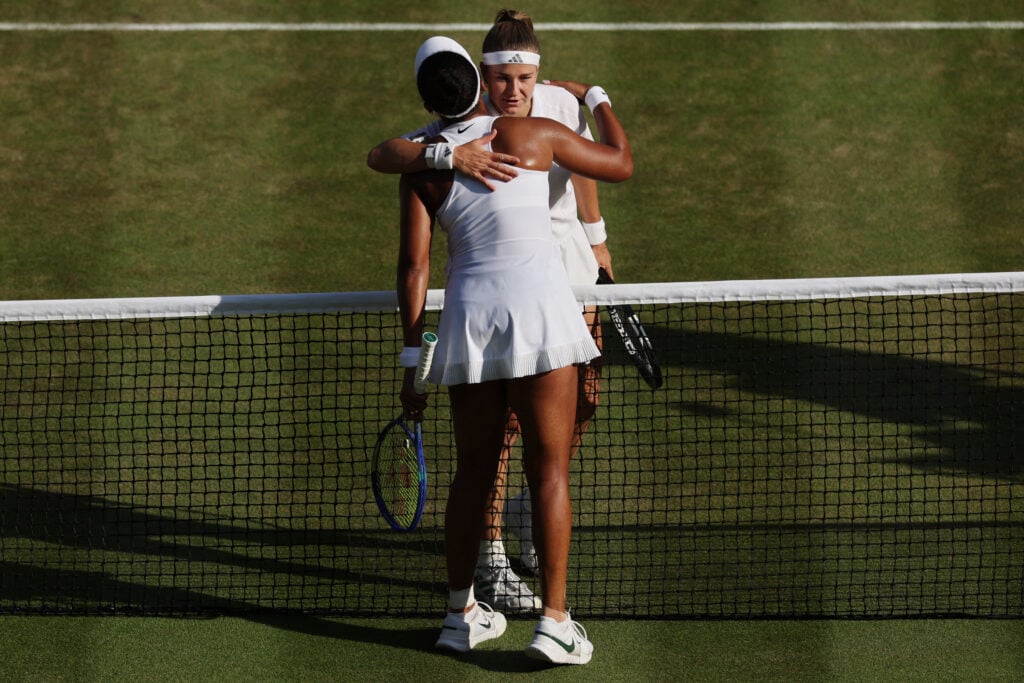 Karolina Muchova hugs Naomi Osaka after beating her at Wimbledon in 2026.
