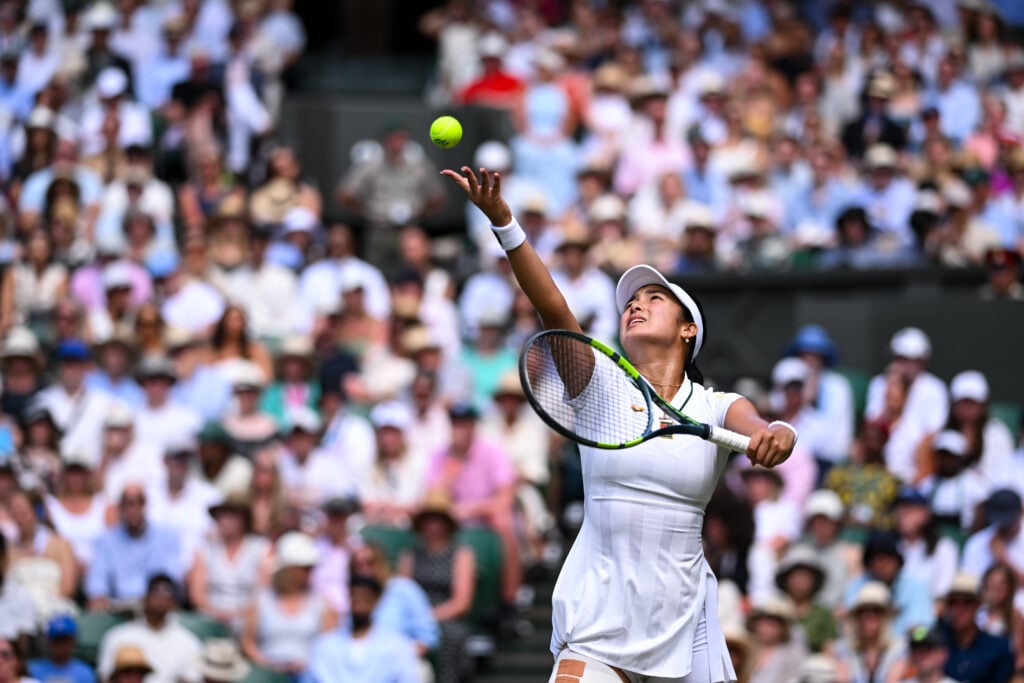 Alex Eala serves against Iga Swiatek at Wimbledon in 2026.