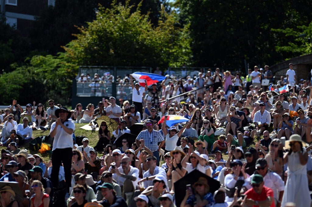 Alexandra Eala's fans watch her beat Iga Swiatek from Henman Hill.