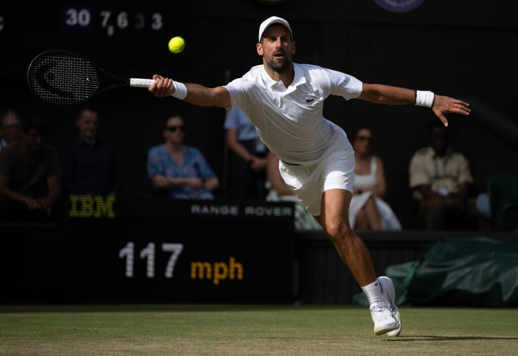 Novak Djokovic in action against Roman Safiullin at Wimbledon in 2026.