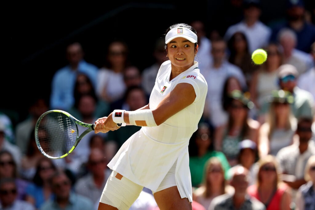 Alexandra Eala of Philippines plays a backhand against Jasmine Paolini of Italy during their Ladies' Singles fourth round match on day eight of The Championships Wimbledon 2026 at All England Lawn Tennis and Croquet Club on July 06, 2026 in London, England.