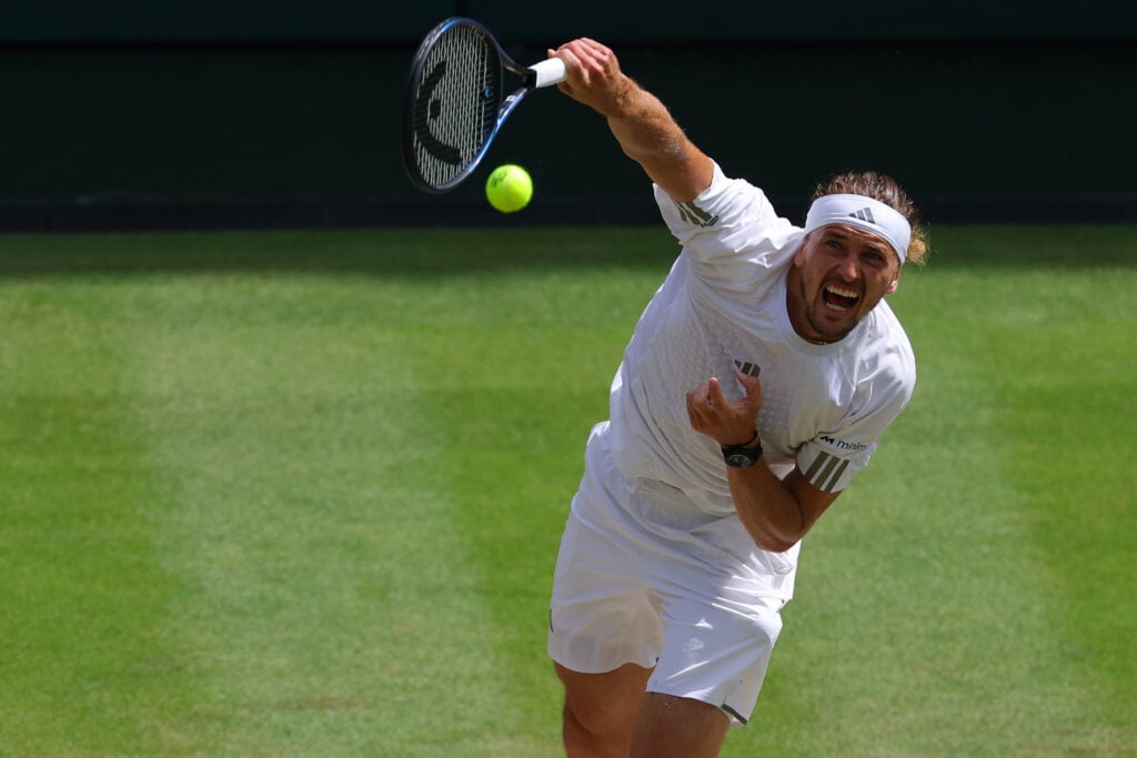 Alexander Zverev hits a serve during the 2026 Wimbledon Championships.