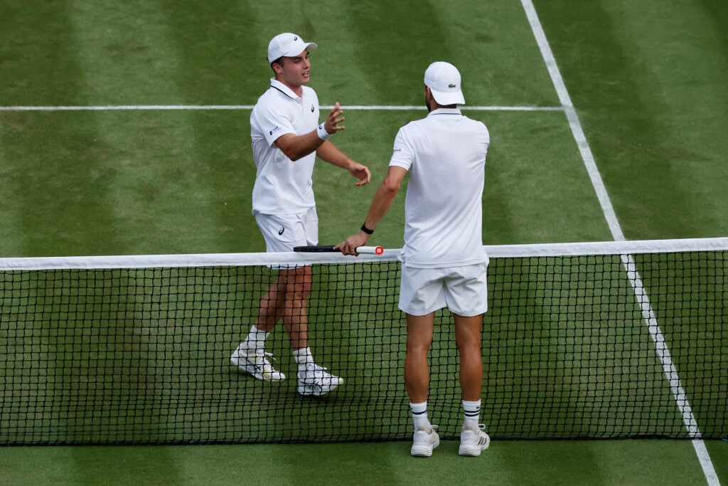Arthur Fery of Great Britain and Grigor Dimitrov of Bulgaria interact at the net following their Gentlemen's Singles fourth round match on day eight of The Championships Wimbledon 2026 at All England Lawn Tennis and Croquet Club on July 06, 2026 in London, England.