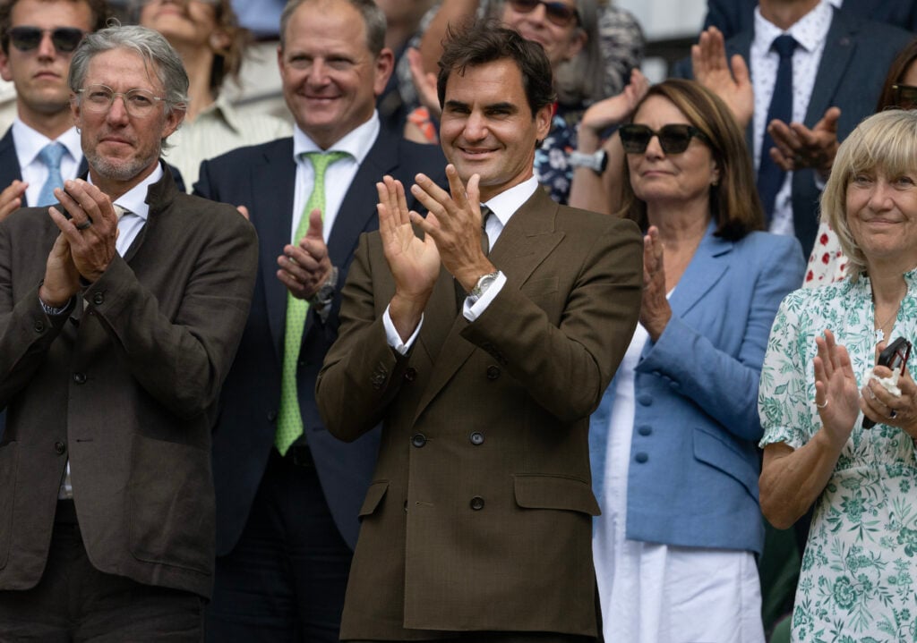 Former tennis player Roger Federer applauds in the Royal Box after watching Arthur Fery of Great Britain beat Grigor Dimitrov of Bulgaria in their Gentlemen's Singles fourth round match on day eight of The Championships Wimbledon 2026 at All England Lawn Tennis and Croquet Club on July 6, 2026 in London, England.