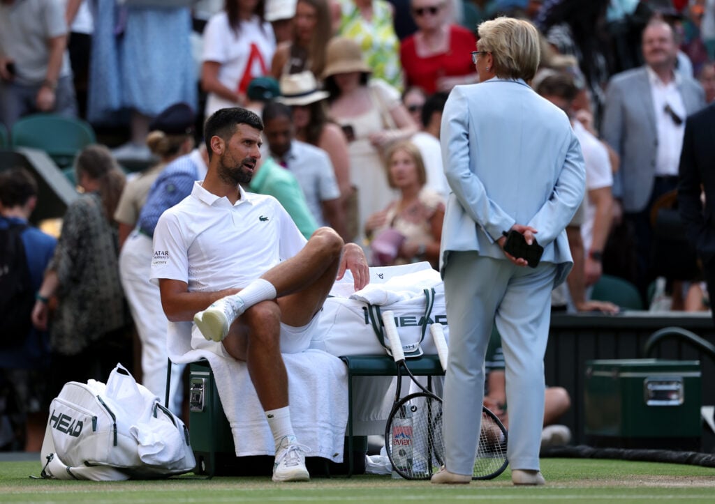 Novak Djokovic of Serbia speaks to Championships Referee Denise Parnell as they shut the roof on Centre Court during his match against Felix Auger-Aliassime of Canada in the Gentlemen's Singles quarterfinal on day nine of The Championships Wimbledon 2026 at All England Lawn Tennis and Croquet Club on July 07, 2026 in London, England.